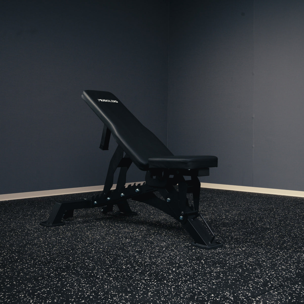 MUSCLEIQ tri-legged commercial weight bench with backrest set to an incline